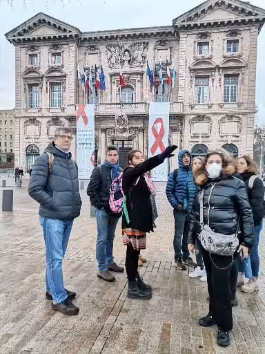 Guided group visit in Avignon city square, exploring Provence Christian heritage and cultural landmarks