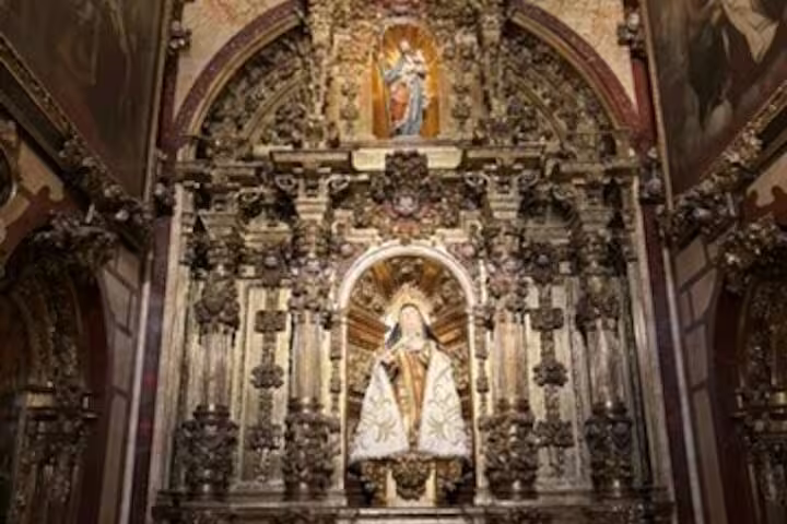 Ornate church altar with Virgin Mary statue in Avila, highlight of half-day private minivan sightseeing tour