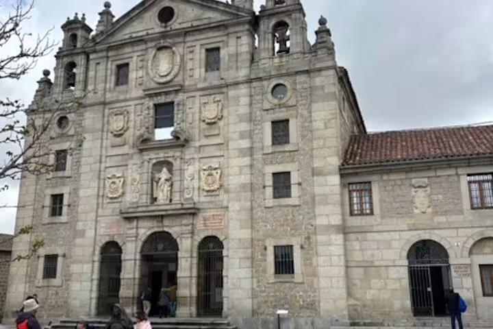 Historic stone church facade in Ávila Old Town visited on an Avila half-day private tour by minivan