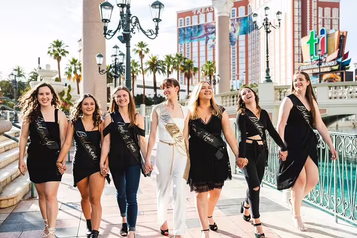 Bachelorette group walking the Las Vegas Strip for a personal vacation photographer tour with candid photos