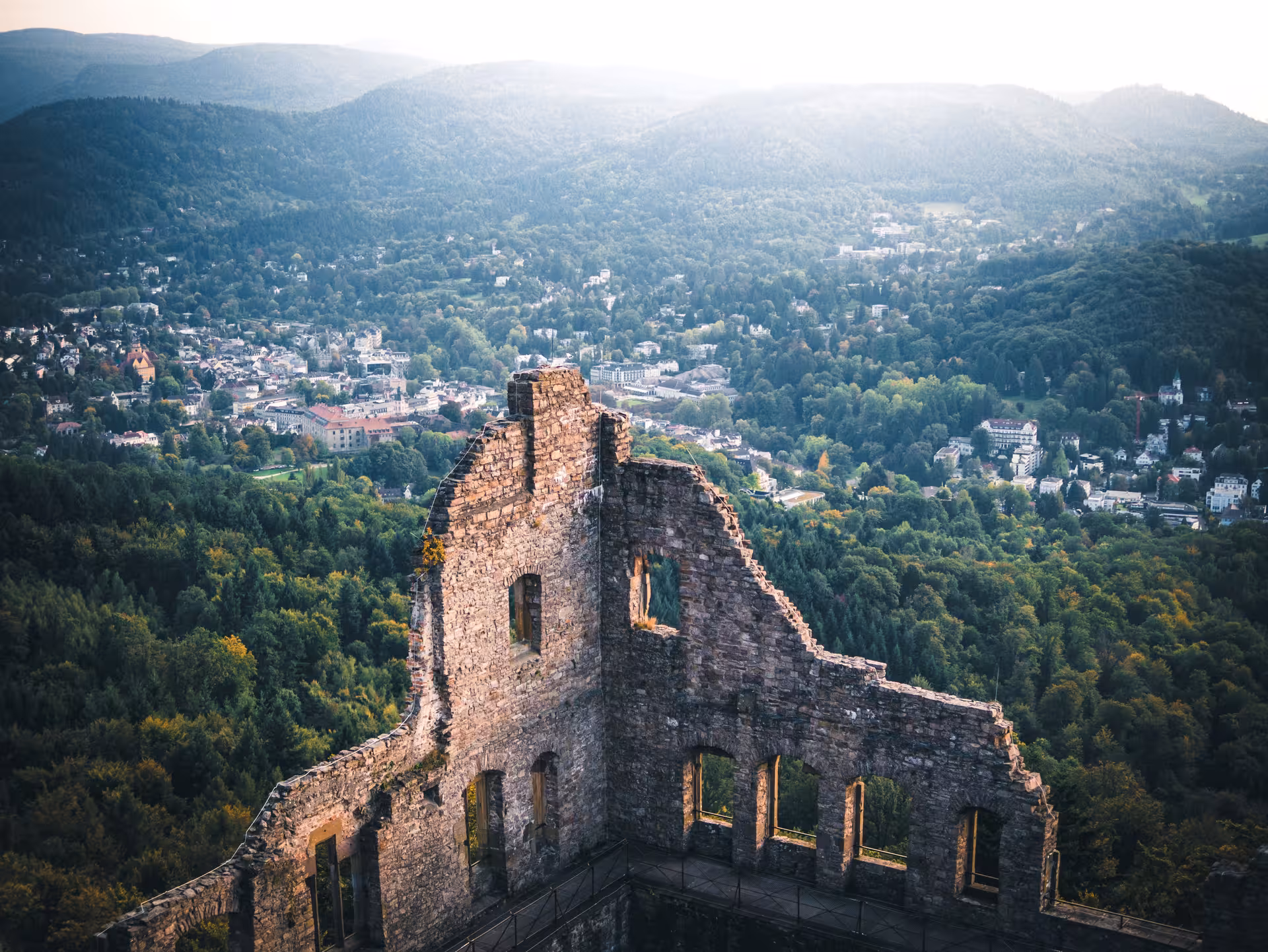 Ancient castle ruins overlooking Baden-Baden town nestled in the lush Black Forest hills