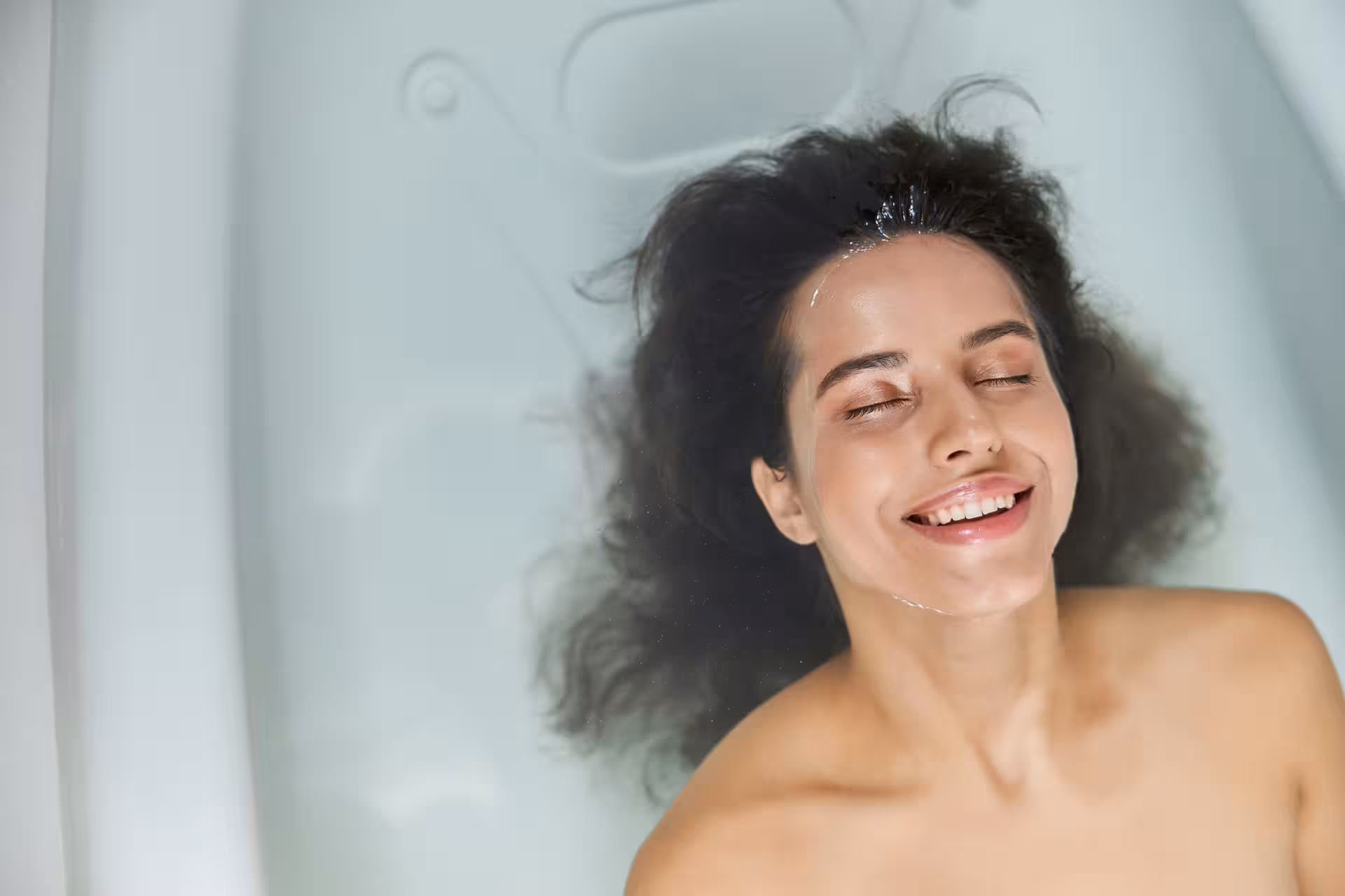 Woman smiling and relaxing in a bath at a Baden-Baden spa