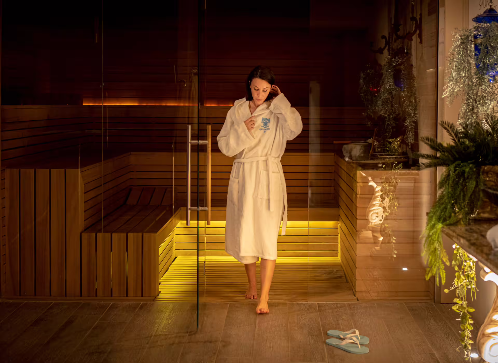 Sauna and spa area in Bagno di Romagna, guest in bathrobe before thermal pool and wellness access