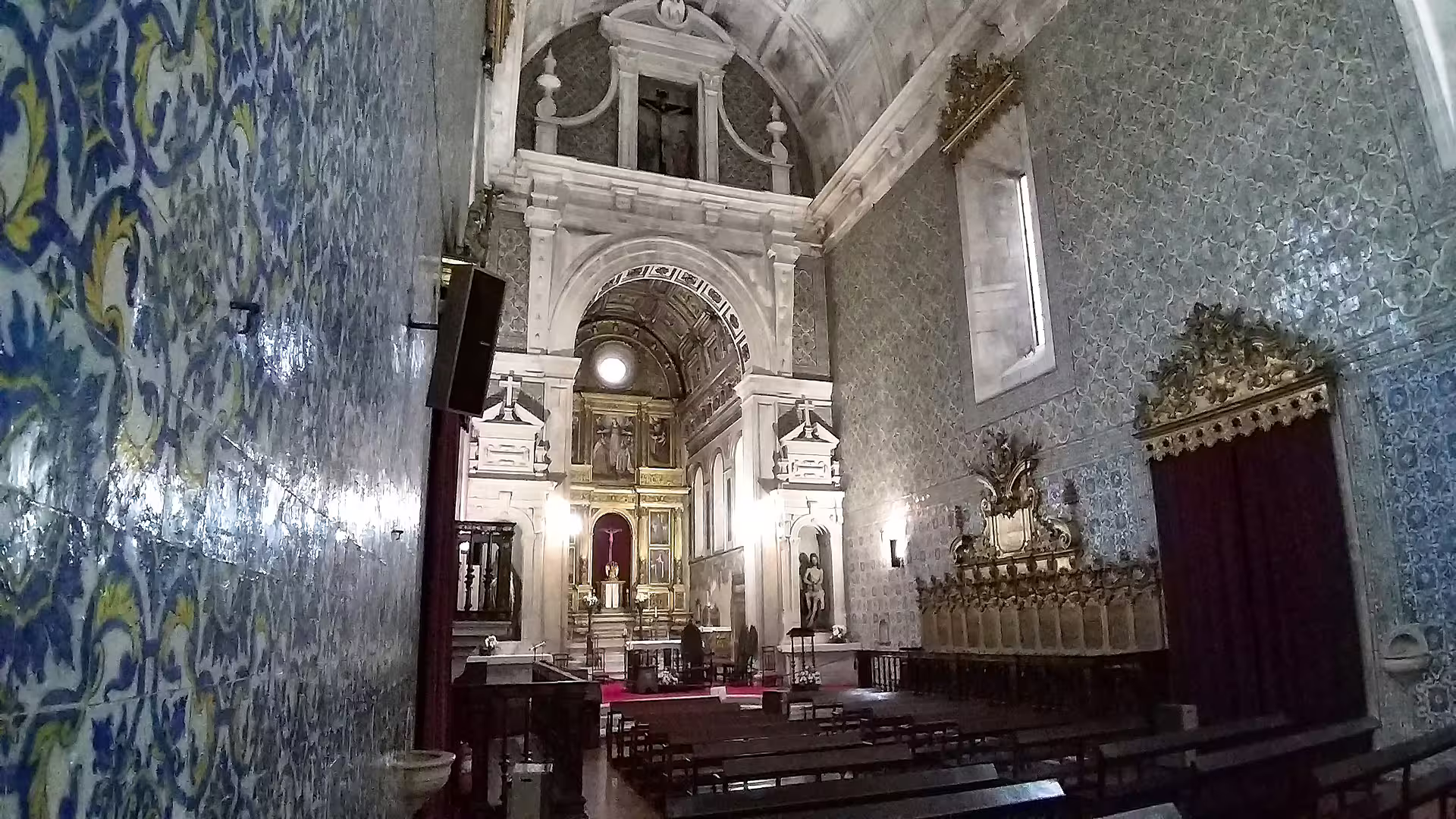 Ornate interior of a historic church in Aveiro with intricate azulejos tiles, featured in Costa Nova private tour.