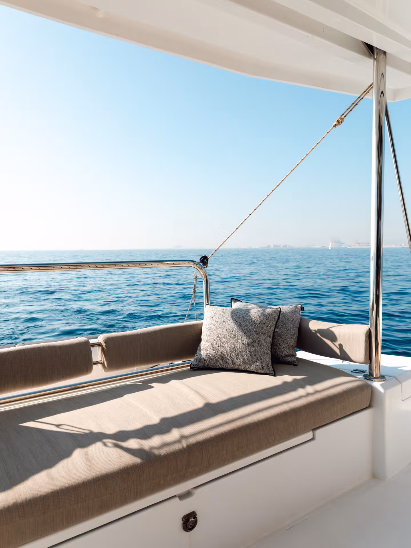 Shaded aft lounge daybed on Bali 4.2 luxury catamaran during 4-hour private Barcelona sailing tour