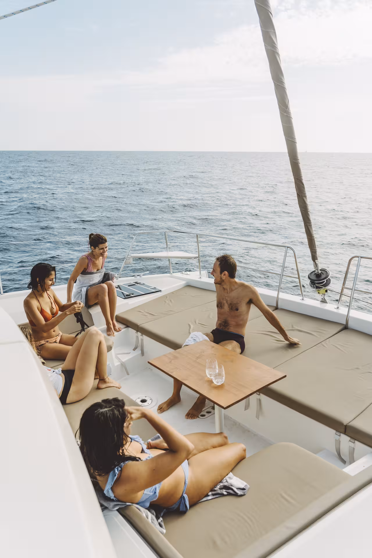 Sunbathing lounge area on Bali 4.1 catamaran, 2-hour private luxury Barcelona sail with drinks on deck