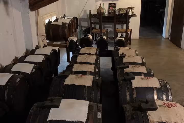 Aging barrels of balsamic vinegar in a traditional Acetaia near Bologna, showcasing Italian culinary heritage.
