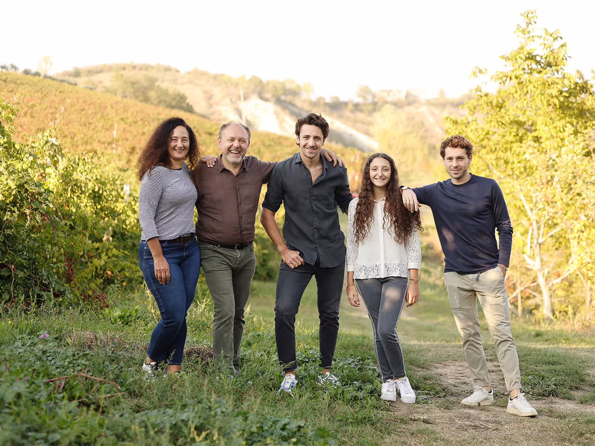 Family of vinegar makers in Modena vineyard, hosts of traditional balsamic vinegar production tour