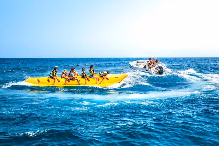 Banana boat ride on the Red Sea in Hurghada, fun add-on during Dolphin House snorkeling trip