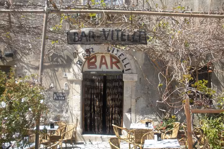 Bar Vitelli's charming rustic facade, a famous Godfather film location, invites visitors to relish authentic Sicilian atmosphere.