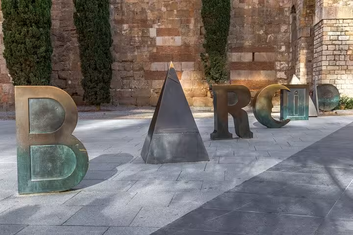 Barcelona sign sculpture in Gothic Quarter plaza on Old Town small group tour of El Born and cathedral area