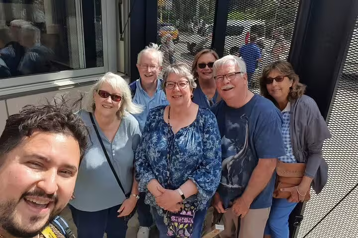 A group of tourists enjoying the Barcelona Premium tour visiting Gothic Quarter, Montjuic, Sagrada Familia, and Park Güell.