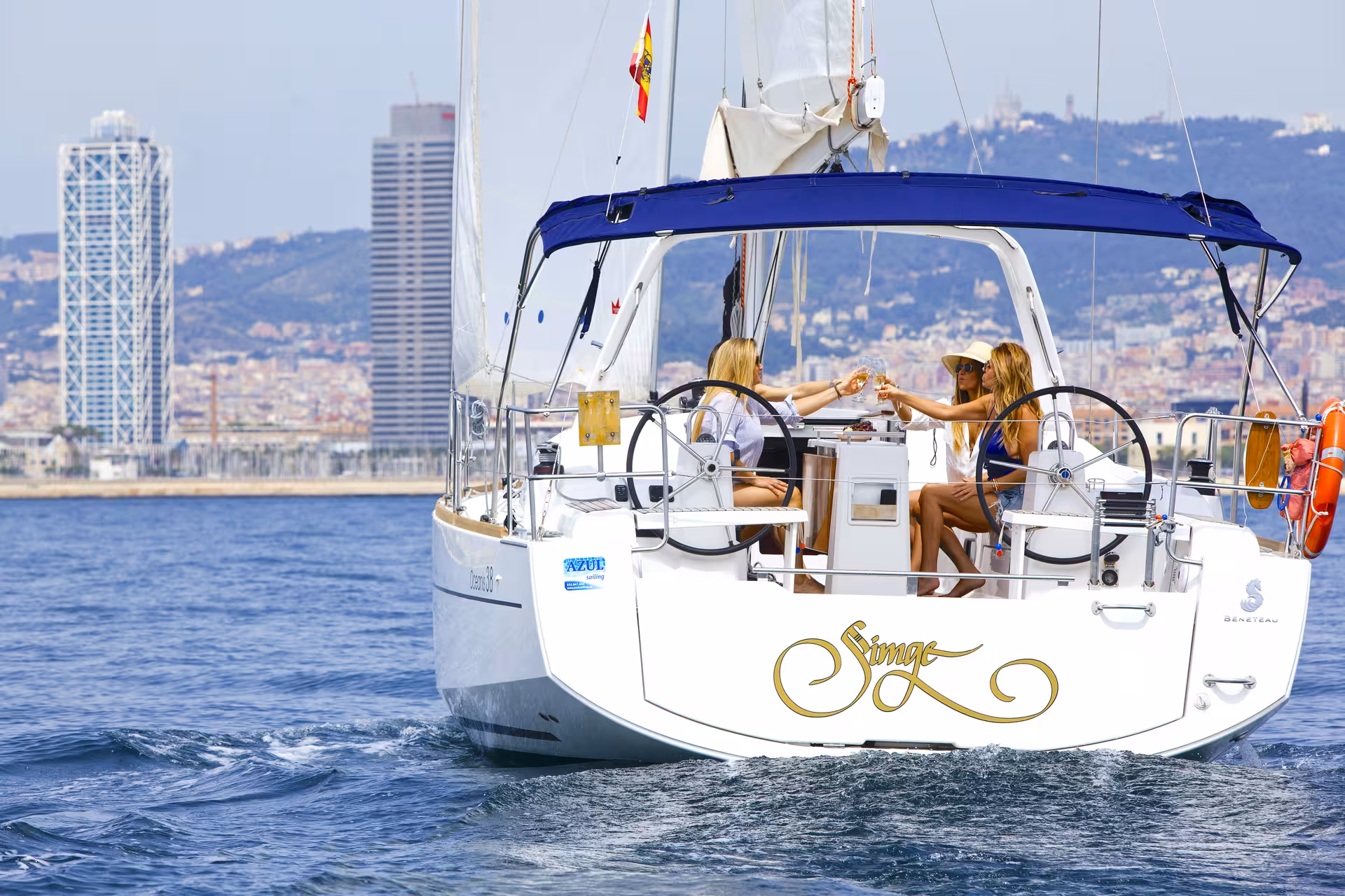 Sailboat cruise in Barcelona with guests toasting drinks, open bar and snacks, skyline views on a 1-hour tour