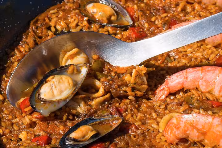 Close-up of seafood paella with mussels and shrimp, highlighting a traditional dish from a Barcelona cooking class.