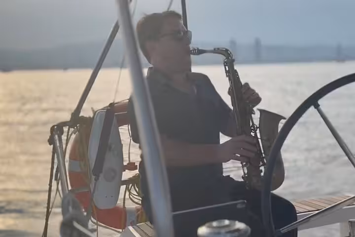 Live saxophone performance on a private Barcelona sunset sailing cruise with open bar on the Mediterranean