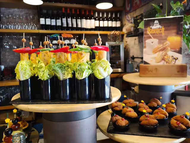 Colorful tapas and wine display in a traditional Barcelona tavern, perfect for a private culinary tour experience.