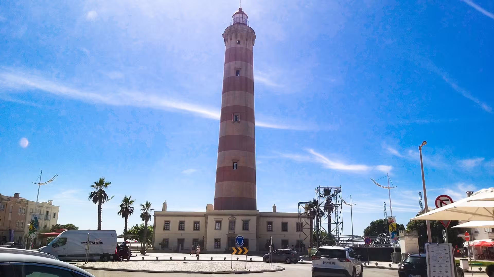 Barra Lighthouse in Aveiro, Portugal, under a clear blue sky, perfect for a scenic stop on your private Lisbon to Porto tour.