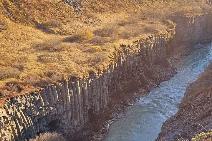 Basalt column canyon with glacial river in Iceland's Golden Circle landscape