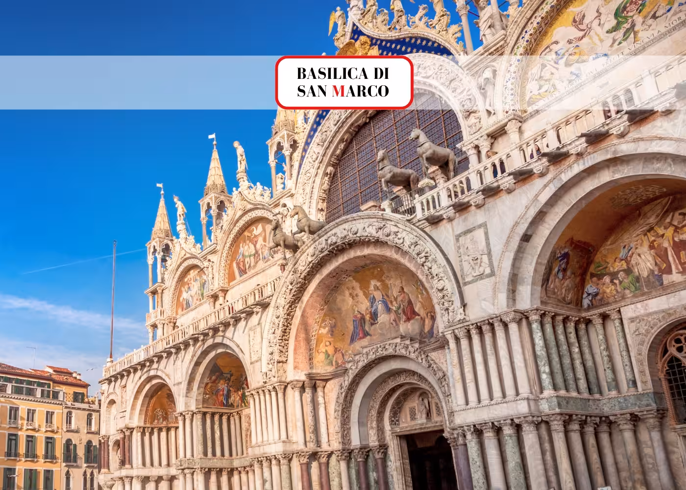 The ornate facade of the Basilica di San Marco in Venice, showcasing intricate mosaics and detailed architecture under a clear blue sky.