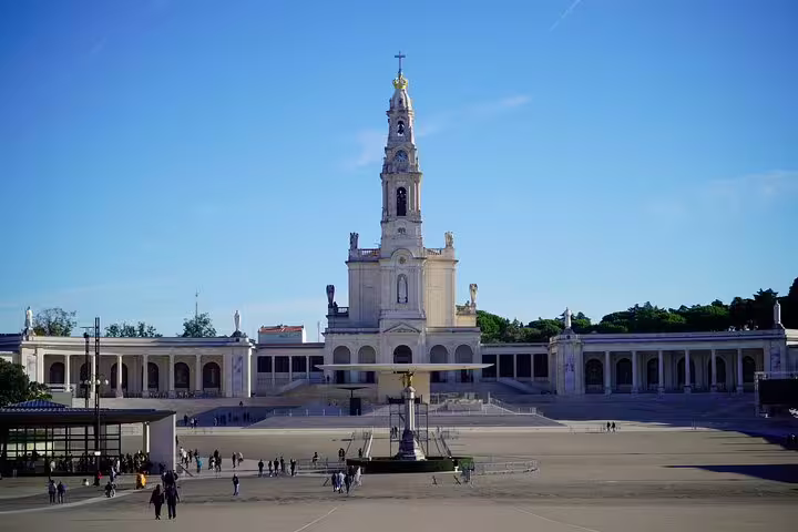 The image showcases the grand Basilica of Our Lady of Fátima, a key attraction on the 3-day Portugal World Heritage tour near Lisbon.