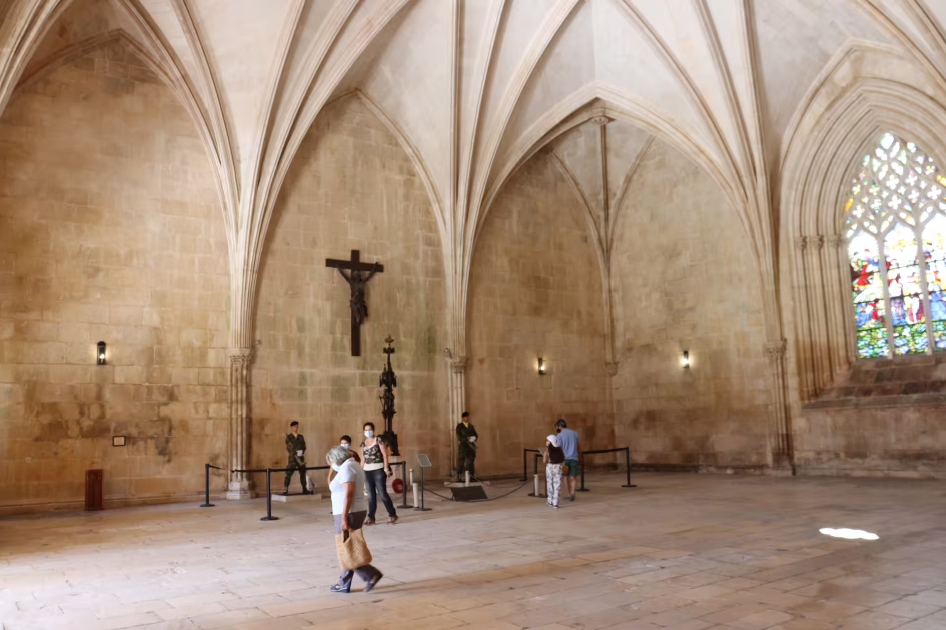 Gothic architecture of Batalha Monastery with lush gardens, featured in a private tour through Tomar, Fátima, and Batalha.