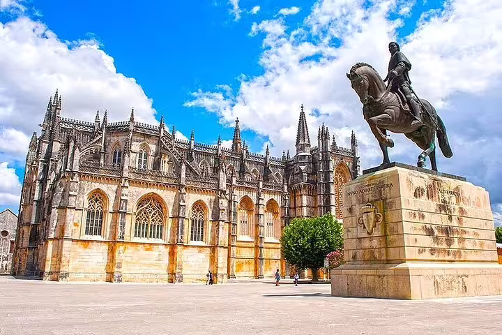 Discover the grandeur of Batalha Monastery and its iconic equestrian statue on the Templars Route tour in Portugal.
