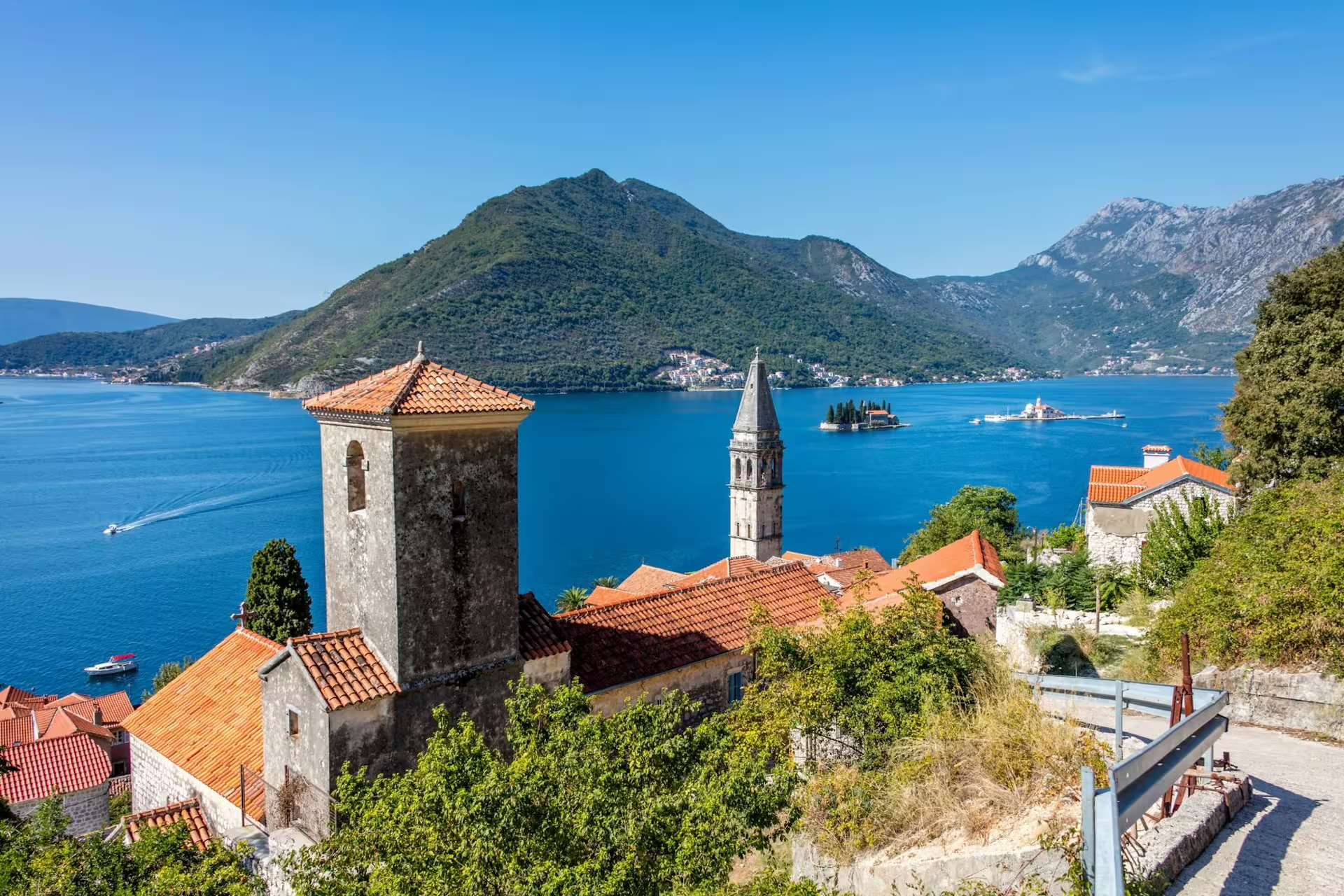 Panoramic Bay of Kotor view with Perast rooftops and Our Lady of the Rocks island, cruise excursion from Dubrovnik