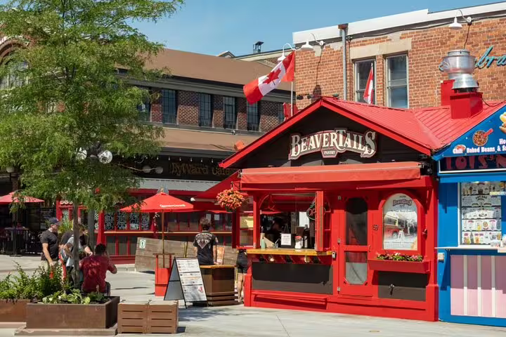 BeaverTails pastry kiosk in Ottawa's ByWard Market with Canadian flag and red exterior