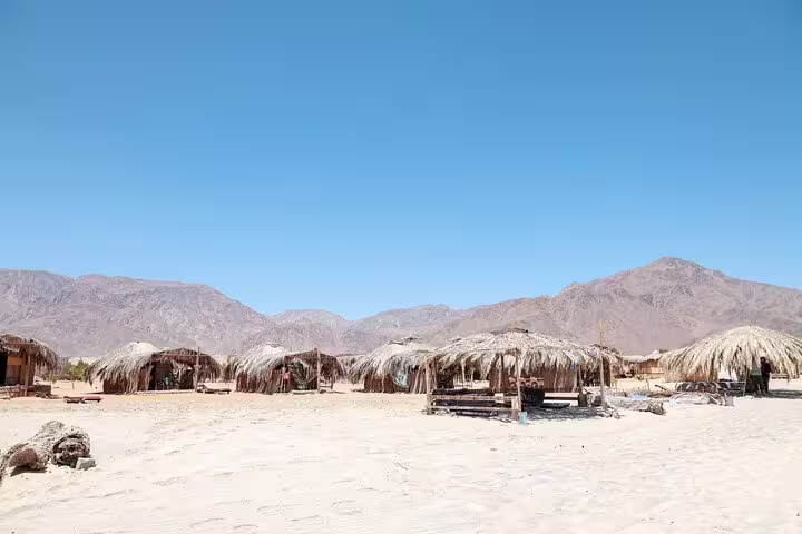 Bedouin desert camp huts in Sinai near Sharm El Sheikh, stop on quad biking tour with dinner