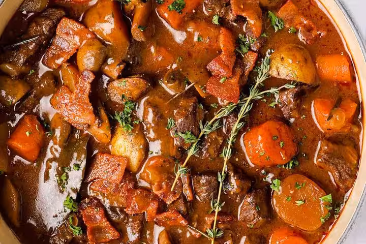 French beef bourguignon dinner served on Montmartre semi-private tour before Paris cabaret show