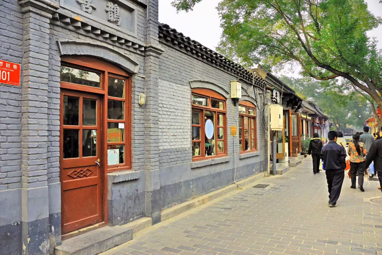 Charming hutong street in Beijing showcasing traditional architecture on a private tour with a Spanish-speaking guide.