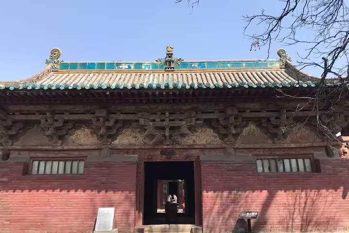 Historic Chinese temple facade in Pingyao, showcasing traditional architecture on the Beijing to Xian bullet train tour.