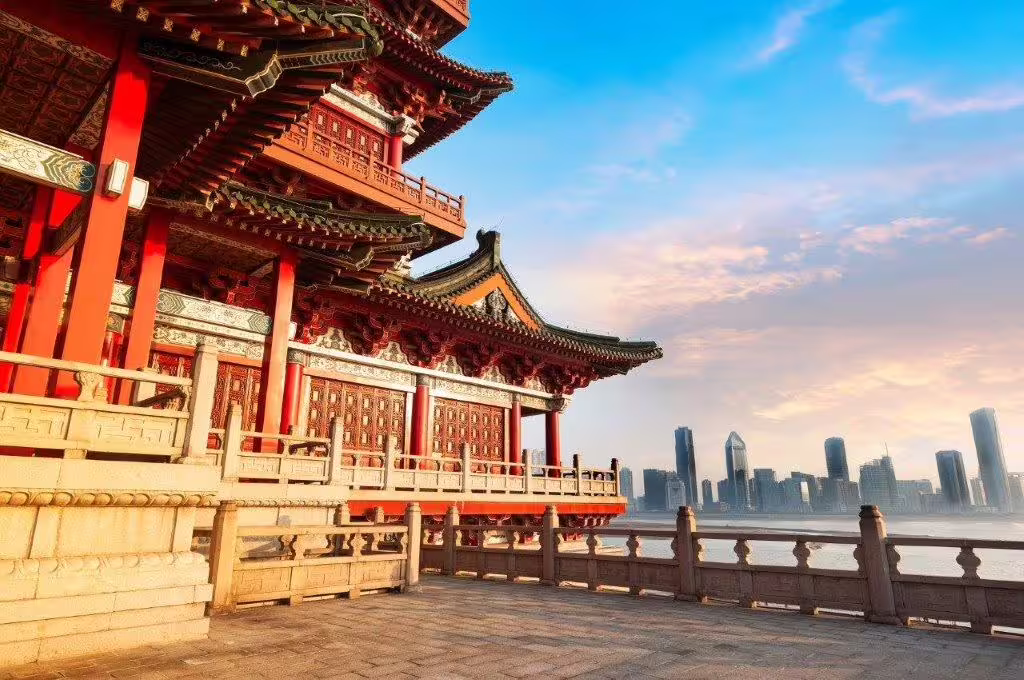 Traditional Chinese architecture in Beijing with modern skyline backdrop, perfect for a cultural city break private tour.