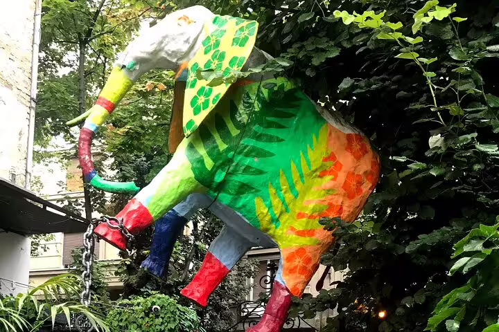 Vibrant elephant street art sculpture in Belgrade courtyard, highlight of private urban adventures walk