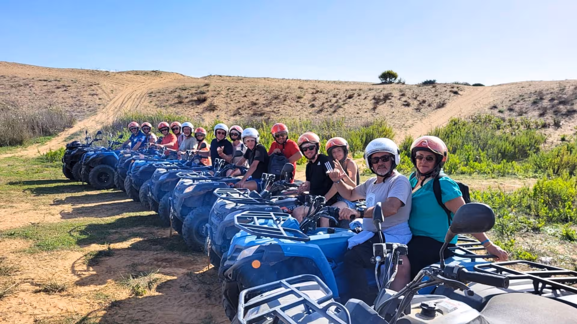 Group of tourists enjoying an exciting ATV adventure through Belice Valley's picturesque sandy trails.