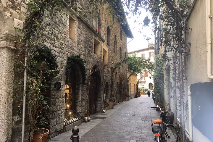 Charming cobblestone lane in Bellagio old town, Lake Como day trip from Milan with local guide