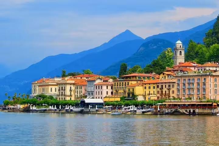 Bellagio waterfront on Lake Como with colorful villas and mountains, on a private Milan to Lake Como day trip