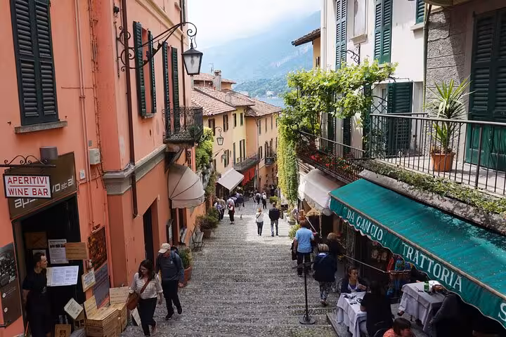 Bellagio old town cobblestone steps with cafes and shops, a highlight of the Lugano to Como cruise tour
