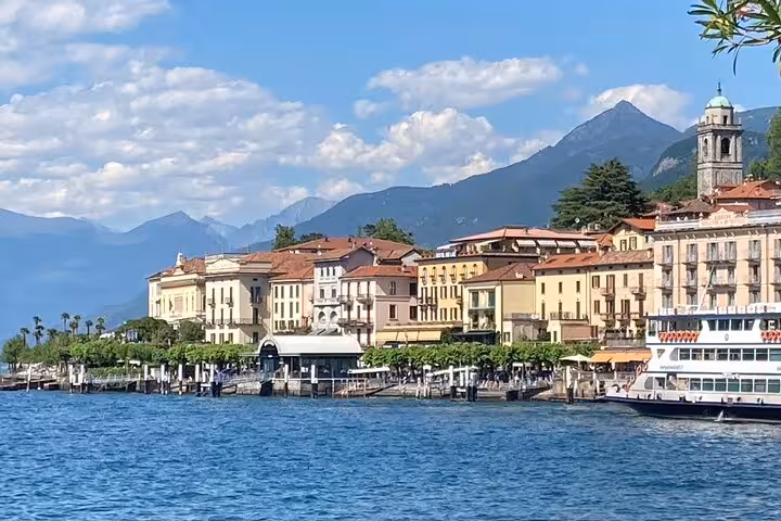 Bellagio waterfront and ferry on Lake Como, panoramic stop during Milan day trip with guided lake cruise