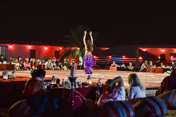 Belly dancer performing night show at Marsa Alam desert camp after Jeep safari adventure dinner experience