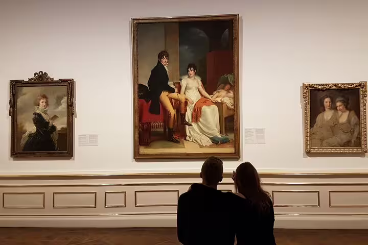 Visitors admire classic portraits in Belvedere Palace's gallery, highlighting Austrian art on a guided private tour.