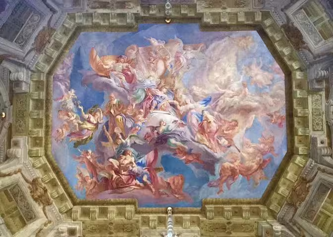 Intricate Baroque ceiling fresco in Belvedere Palace, showcasing vibrant mythological scenes on a private art tour.