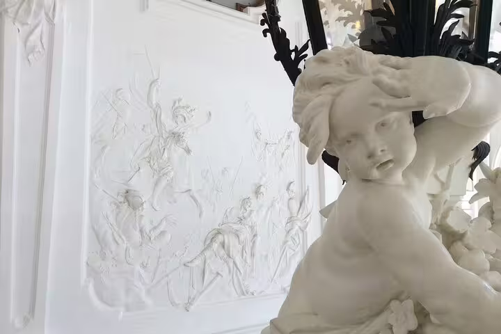 Intricate white sculpture and relief at Belvedere Palace, highlighting Baroque artistry on an art historian-led tour.