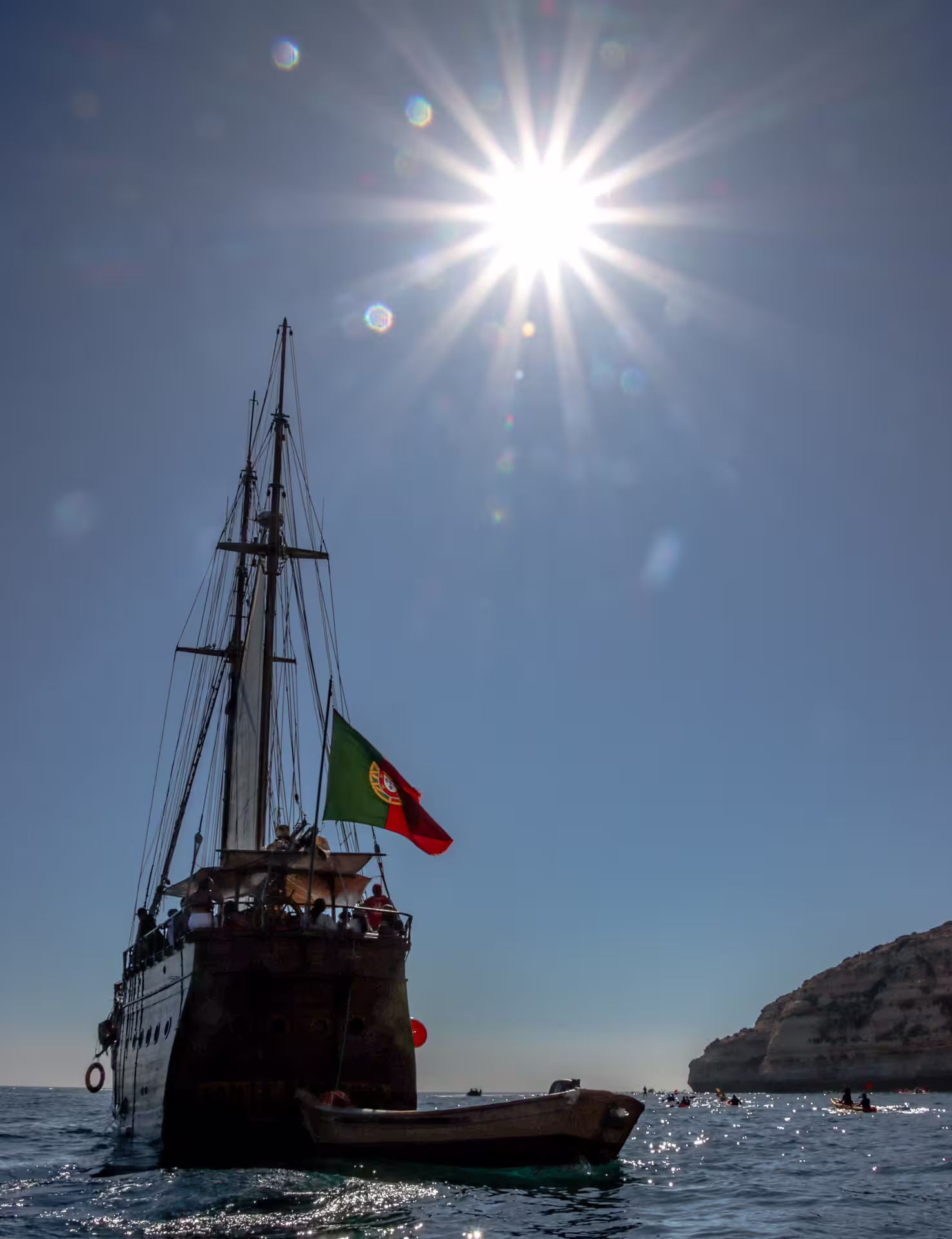 Majestic ship sails under the bright sun near Benagil, showcasing Portugal's coastal beauty on an afternoon cruise.
