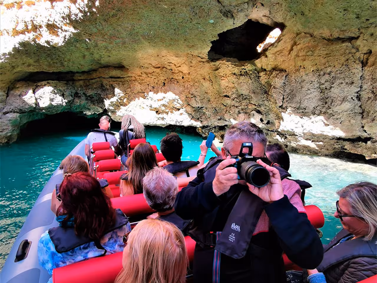 Guests on a Benagil cave boat tour from Albufeira Marina cruising through Algarve sea caves and turquoise water