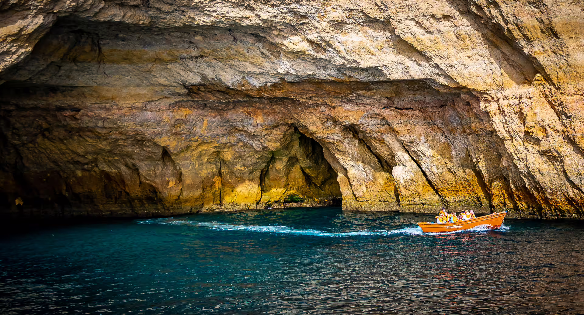 Experience the thrill of a boat tour into the majestic Benagil cave formations along the Algarve coast, ideal for adventure seekers.