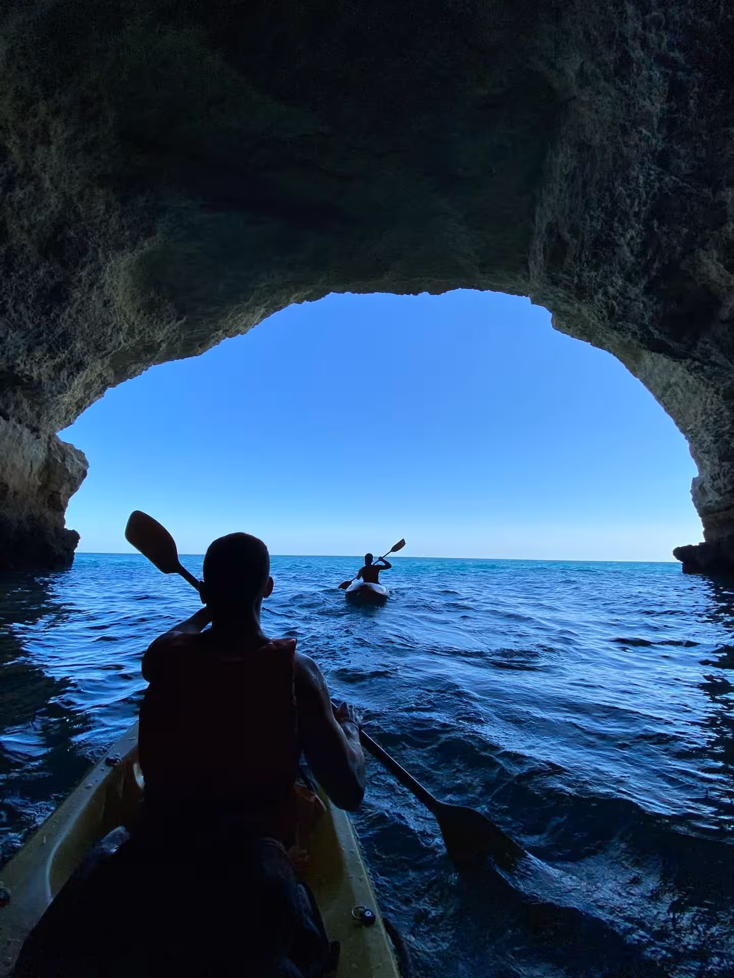 Kayaking out of Benagil Cave to open Atlantic, POV from kayak on Algarve sea caves tour with Benagil kayak rental