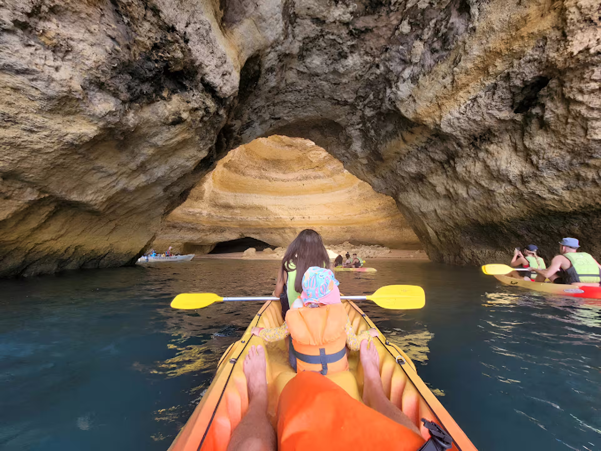Kayakers explore the stunning Benagil Cave with a local guide, enjoying a small group tour and comfortable gear.