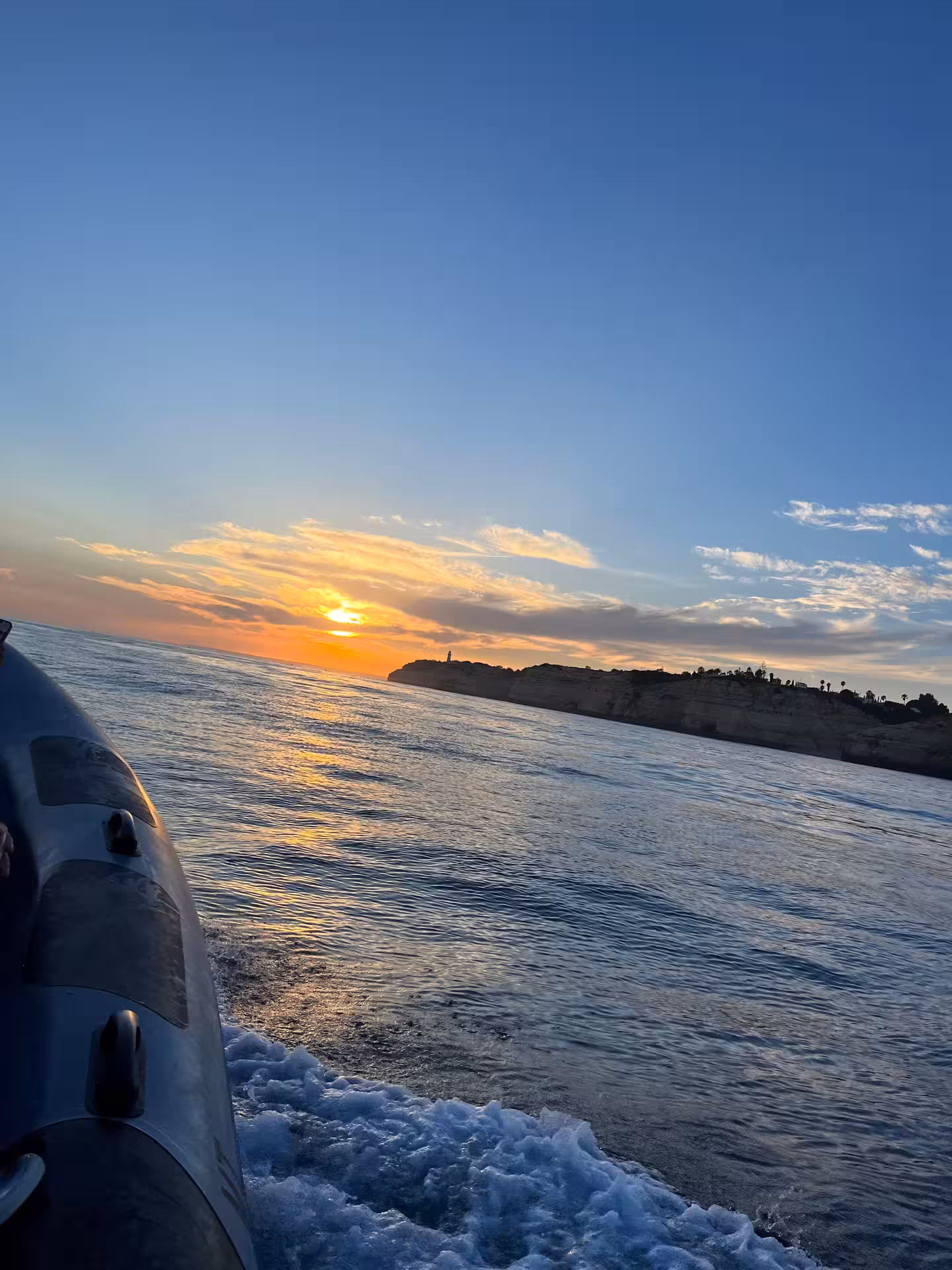 Experience a stunning sunset view from a private tour boat on serene waters, perfect for a memorable getaway.