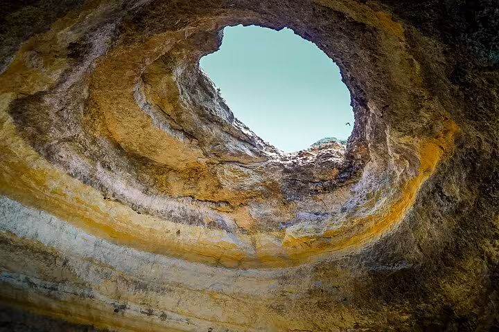 Inside Benagil Cave skylight dome, Algarve boat trip highlight on private tour from Lisbon day excursion